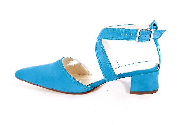 Turquoise blue women's open back shoes, with crossed straps. Tapered toe. Low flare heels. Profile view - Florence KOOIJMAN